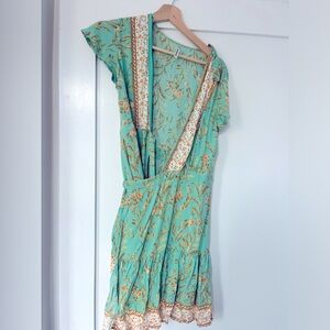 Green and white floral wrap dress